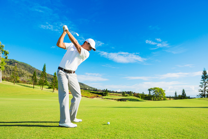 Golfer getting ready to drive Golf Ball